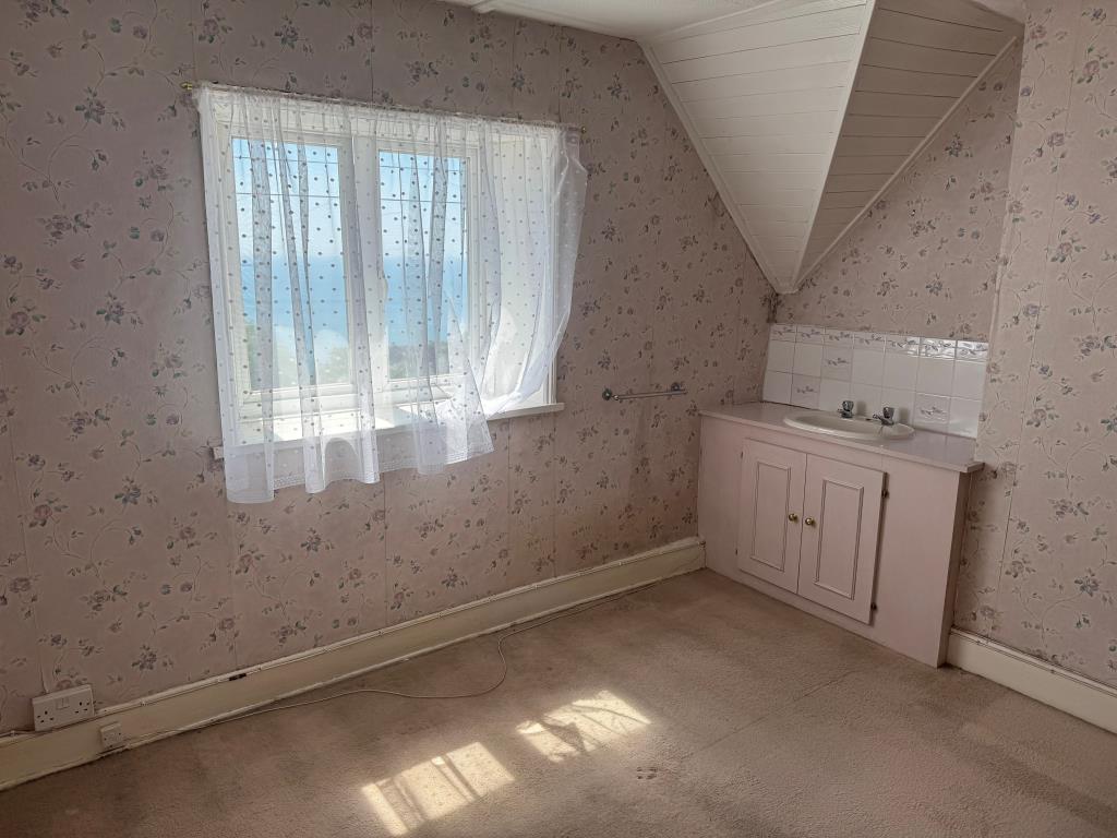 Lot: 147 - COTTAGE FOR IMPROVEMENT WITH SEA VIEWS - The Front Bedroom